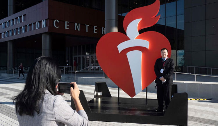An ISC22 attendee poses in front of the Ernest Morial Convention Center in New Orleans, Louisiana.