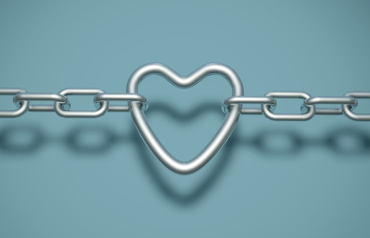 A heart link in a strong steel chain on a cyan background.