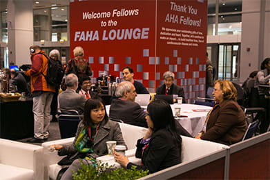 Attendees and speakers in the FAHA Lounge during Scientific Sessions.